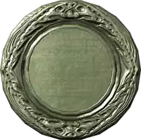 a silver plate with a floral design around the edge