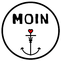 a black circle with the word moin and an anchor