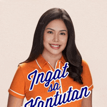 a woman wearing an orange shirt that says " ingat sa kantutan " on it