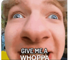 a close up of a person 's face with the words " give me a whoppa " written on it