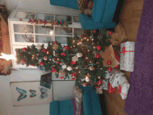 a living room with a christmas tree and presents underneath