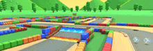 a blurred image of a colorful race track with trees in the background .