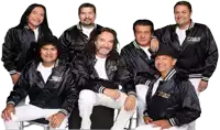 a group of men are posing for a picture and one of their jackets has the word ukis on the front