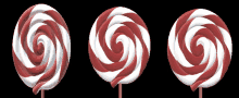 red and white swirl lollipops on a black background