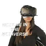 a woman is wearing a virtual reality headset and a helmet .