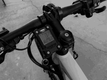 a black and white photo of a bicycle with a yamaha display