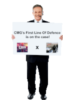 a man holding a sign that says cmg 's first line of defence