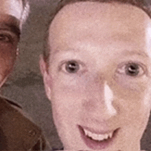 a close up of a man 's face and another man 's face in a blurry photo .