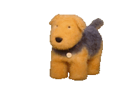 a brown and black stuffed dog with a tag that says ' snoopy ' on it