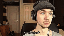 a man wearing headphones and a hat says ' screeches '