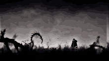 a black and white photo of a man standing in a field with a monster in the background