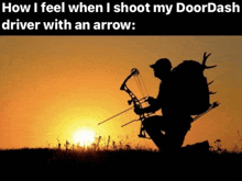 a silhouette of a man kneeling down with a bow and arrow