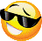 a pixel art of a smiley face wearing sunglasses and smiling .