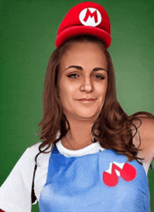 a woman wearing a mario hat and an apron