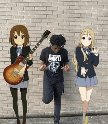 a man wearing a hatsumi miku shirt stands between two anime girls