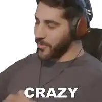 a man wearing headphones has the word crazy written on his shirt