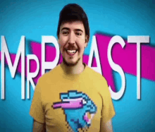 a man wearing a yellow t-shirt with a pixelated bird on it is smiling in front of a blue and pink background .