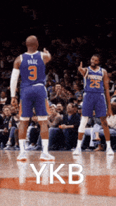 a basketball player with the number 3 on his back is giving a thumbs up