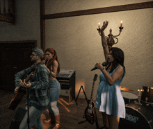 a woman singing in front of a band with a drum that says andret berg on it