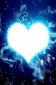 a blue heart is surrounded by smoke and stars on a dark blue background .