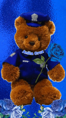 a teddy bear wearing a nypd uniform holds a blue rose