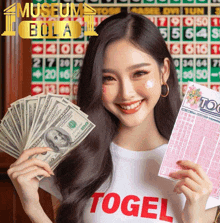 a woman wearing a white shirt that says ' togel ' on it holds a bunch of money