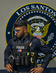 a man in a police uniform stands in front of a los santos seal