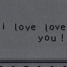 a close up of a computer screen with the words `` i love you '' on it .