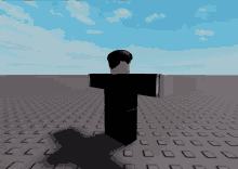 a man in a black shirt is standing on a tile floor