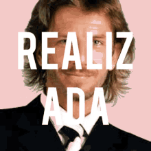 a man in a suit and tie with the words realiz ada written above him