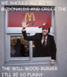 a man in a suit and hat is standing in front of a window at a mcdonald 's .