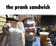 a man holding a bag of taco bell food and a drink with the prank sandwich written above him