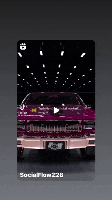 a purple car is displayed on a social flow228 video