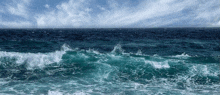 a large body of water with waves breaking on the shore