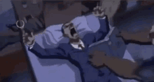 a man in a suit and tie is laying on a bed holding a gun and screaming .