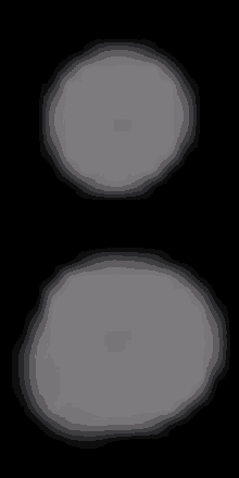 two white circles on a black background are floating in the air