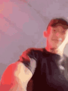 a blurry picture of a man 's face with a red background