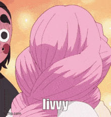 a person with a pink scarf around their head is standing next to a person with a mask on .