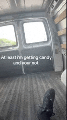 at least i 'm getting candy and your not is written on the side of a van .