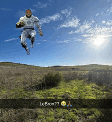 a picture of lebron jumping in the air with a caption that says lebron