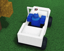 a white vehicle with a blue person in the back