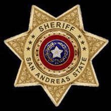 a golden sheriff 's badge from san andreas state with a star in the middle .