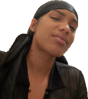 a woman wearing a black scarf around her head is smiling