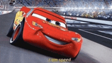 lightning mcqueen from the movie cars is driving on a race track .