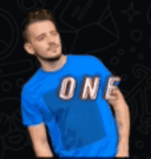 a man is wearing a blue shirt with the word one on it