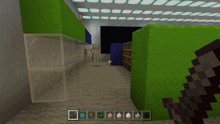 a screenshot of a minecraft game showing a skeleton and a green block