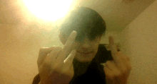 a person giving the middle finger in front of their face