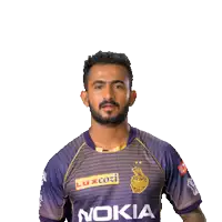 a man wearing a purple kia shirt is giving the middle finger