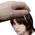 a hand is holding a woman 's head in a pixelated image .