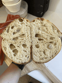 a loaf of bread is cut in half showing the inside